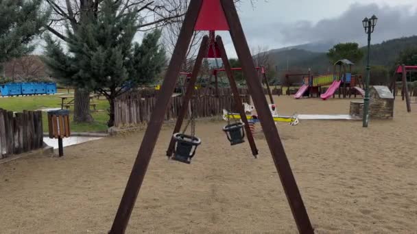 Wooden Swings Kids Playground Rainy Gloomy Day — ストック動画