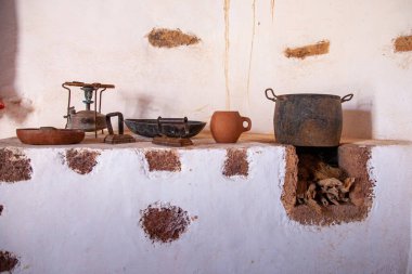 old dirty clay pot with a bucket