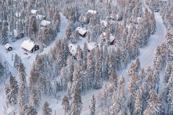 stock image Aerial view to houses in the woods in Finnish Lapland near Rovaniemi. Typical finnish winter scenery