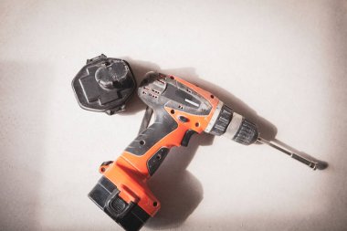 Yellow cordless electronic screwdriver drill