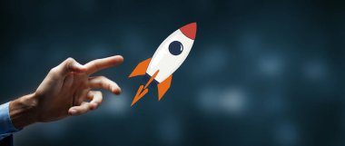 Elinde roket olan bir iş adamı. karışık ortam