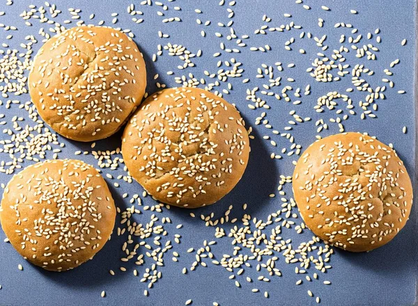 delicious burger with sesame seeds and cheese on white background
