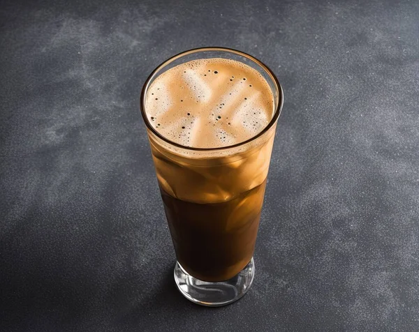 glass of iced coffee with ice on black background