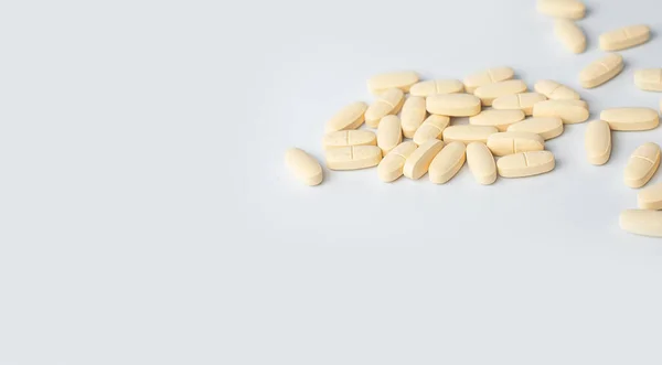 Close-up of drugs, pills, tablets, vitamins in season of colds and flu over white background. Concept of healthy lifestyle and treatment. Copy space for advertisement.