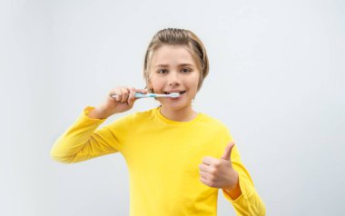 Teenager Boy Brush Teeth Child Looking At Camera Over White Background , Dentistry, Stomatology, Dental Care Hygiene With Toothbrush Toothpaste, Morning Evening Routine, Lifestyle, Health Care.