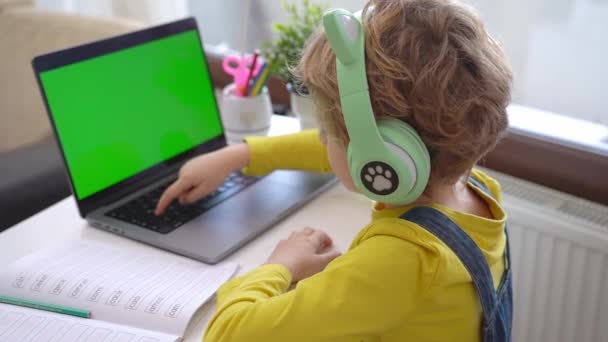 Cute Smart Caucasian Primary School Child Headphones Typing Keyboard Laptop — Stock Video