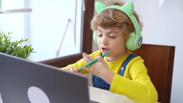Cute Smart Caucasian Primary School Child Headphones Educate Online Laptop — ストック動画