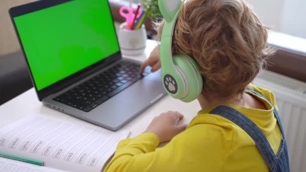 Schoolboy Child Headphones Wireless Hands Typing Keyboard Using Touchscreen Laptop — стоковое видео
