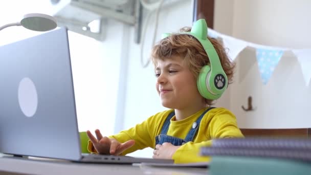 Cute Smart Caucasian Primary School Child Headphones Educate Online Laptop — Video Stock