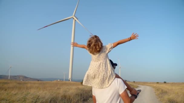 Man Carrying His Child Girl His Shoulders Walking Wind Farm — Video Stock