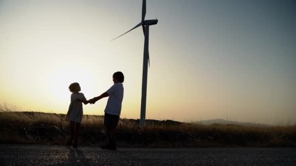 Spinning Turn Holding Hands Nature Sunset Field Windmill Wind Generator — Stock Video