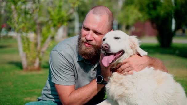 Man Pet Owner Plays His Happy Pet Dog Golden Retriever — Stock Video