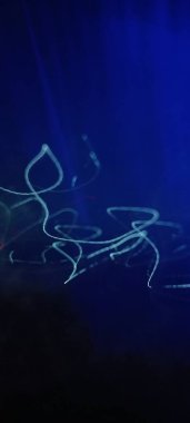 Simulation of galaxy light motion of stars in dark background, future energy and data technology of cyber programming concept in blue theme for presentation abstract background used. light speed tech. Plexus abstract technology engineering background