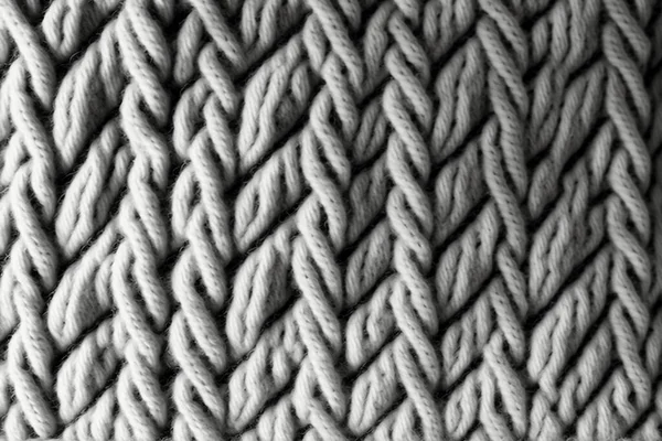 Seamless mottled light grey wool knit fabric background.
