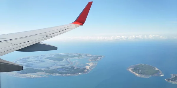 Beautiful view of small islands in the plane in the plane