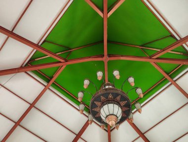The interior of the mosque is decorated with a green dome clipart