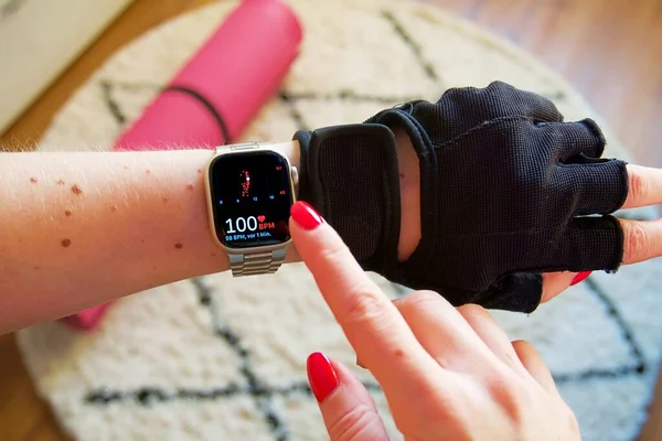 female hands with smart watch