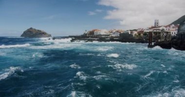 Garachico town and waves in slow motion. Tenerife island, Canary islands, Atlantic ocean, Spain.