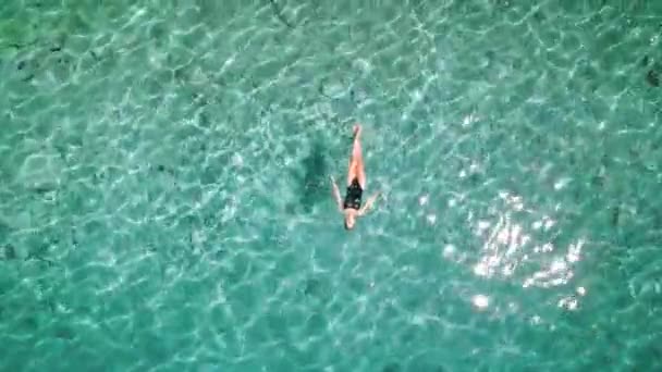 Woman Swimmer Black Swimsuit Floats Effortlessly Crystal Clear Sea Waters — Stock Video