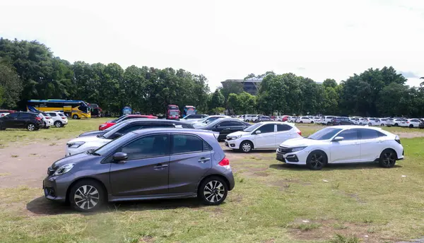 stock image Indonesia - March 3 2024: Gadjah Mada University (UGM) Yogyakarta parking area. Grha Sabha Pramana UGM Building