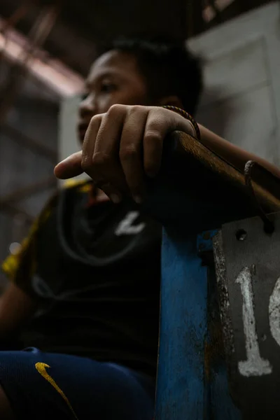 a child becomes a referee in a badminton game at the badminton hall located in Jambi