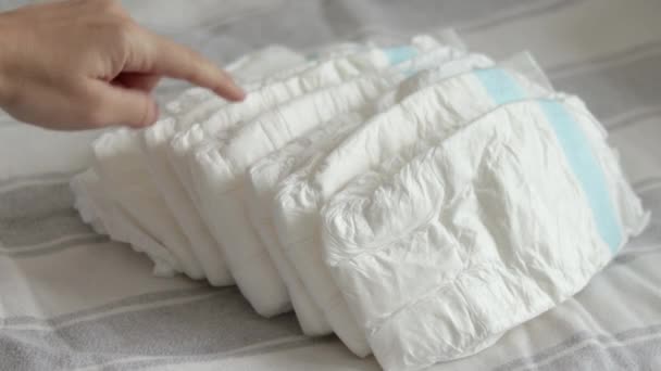 Baby Diapers Pack Woman Mother Hand Bed Finger Counting Throwing — 图库视频影像
