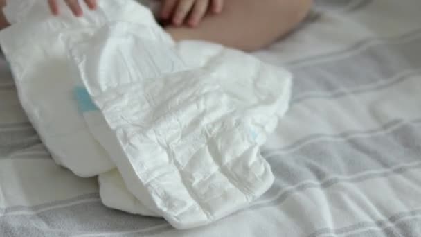 Baby Diapers Pack Woman Mother Hand Bed Finger Counting Throwing — Stok Video