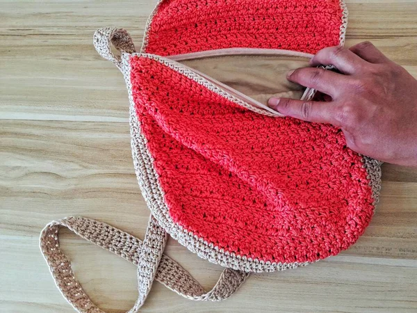 The Red Knitting women bag opened by hand softly