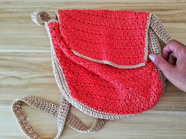 The Red Knitting women bag touched by hand softly