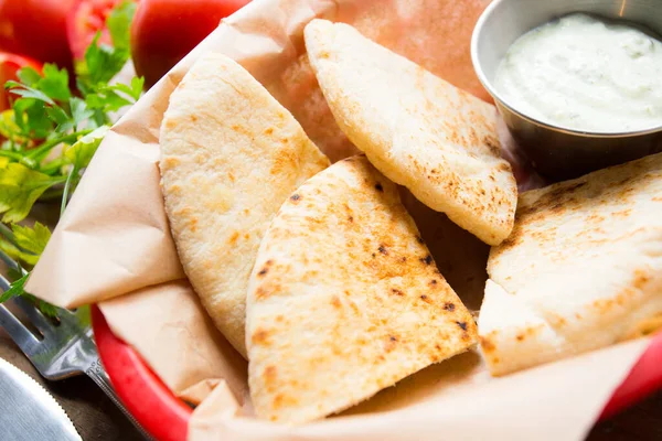 Pita bread is a type of soft, slightly fermented flatbread made from wheat flour, eaten in the Mediterranean area, especially in the Near East