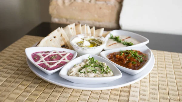 Different Sauces Israeli Restaurant Beetroot Sauce Tahini Baba Ganush Hummus —  Fotos de Stock
