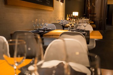 Elegant restaurant table with cutlery, crockery and glasses.