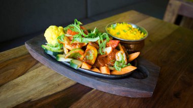 Tandori chicken is a roast chicken dish very famous in India.