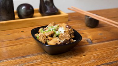 Tofu in a small bowl to accompany a dish in Japan.