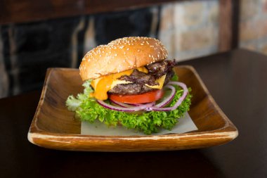 Authentic top quality American Burger with bacon, egg and salad.