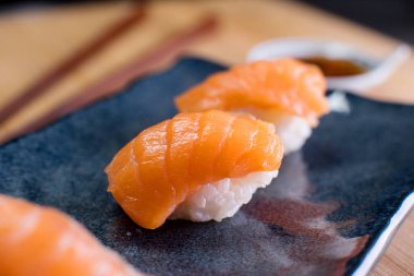 Salmon sushi nigiri in a Japanese restaurant in Tokyo.