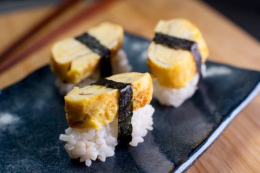 Japanese egg nigiri in a restaurant in Tokyo