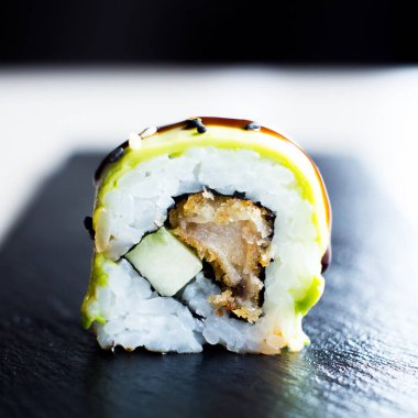 Sushi roll with chicken and vegetables served in a Tokyo restaurant.
