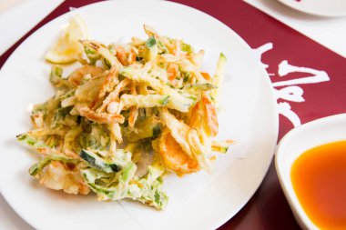 Japanese tempura with vegetables and seafood.
