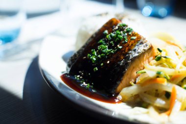 Salmon cooked with teriyaki sauce. Traditional Japanese recipe.