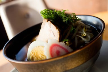 Japanese soup Ramen with pork and vegetables. Traditional Osaka recipe.