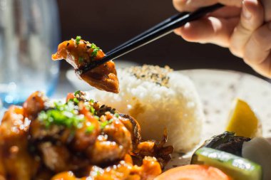 Chicken cooked with teriyaki sauce. Traditional Japanese recipe.