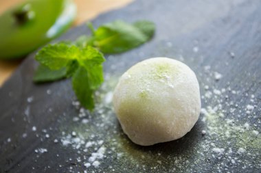Mochi is a Japanese cake made from mochigome, a small glutinous grain of rice. The rice is pounded into a paste and molded into the desired shape.