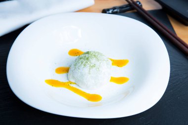 Mochi is a Japanese cake made from mochigome, a small glutinous grain of rice. The rice is pounded into a paste and molded into the desired shape.