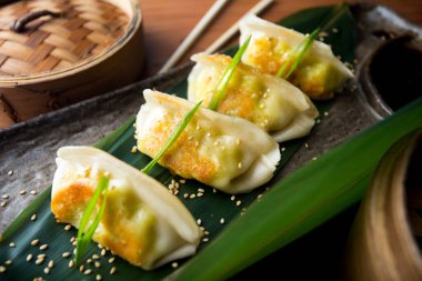 Japanese gyoza. Rice pasta dumplings stuffed with meat, fish or vegetables. They are cooked on the grill or fried.