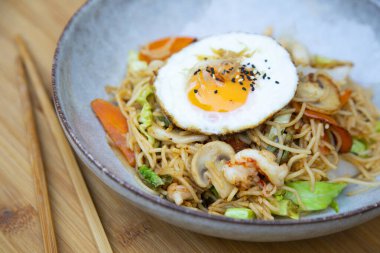 Yakisoba noddles with vegetables, seafood and egg