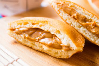 Dorayaki with dulce de leche. Dorayaki is a type of Japanese sweet that consists of two round-shaped cakes filled with anko, which is a bean paste made with azuki bean variant.