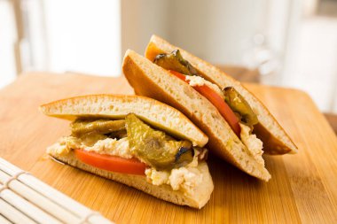 Dorayaki with vegetables. Dorayaki is a type of Japanese sweet that consists of two round-shaped cakes filled with anko, which is a bean paste made with azuki bean variant.