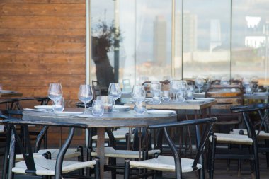 Elegant restaurant table with cutlery, crockery and glasses.