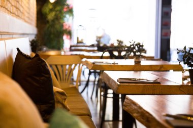 Elegant restaurant table with cutlery, crockery and glasses.